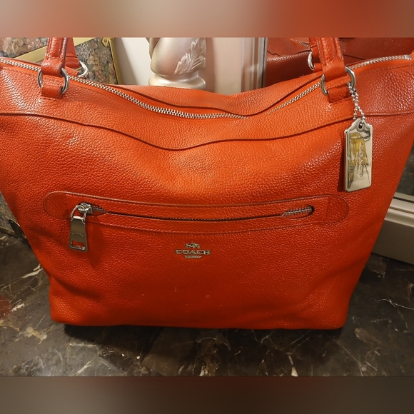 Coach Tyler Tote in an orange/red shade of pebbled leather. - Picture 13 of 16